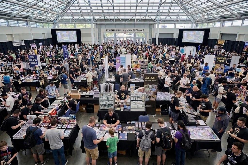 Side Quest Events event hall, collectors browsing trading cards